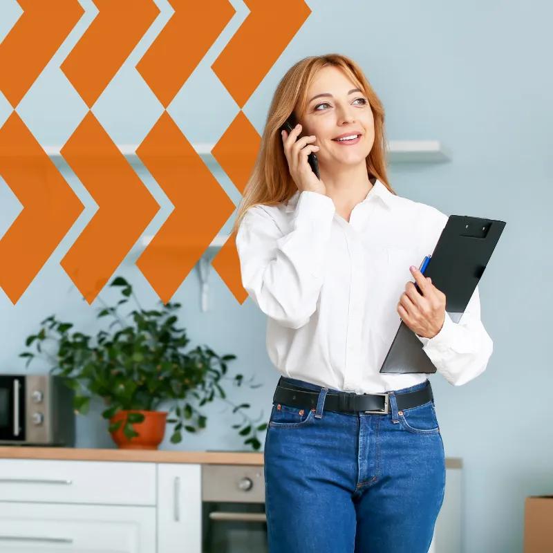 woman talking on the phone with sales team about sales performance