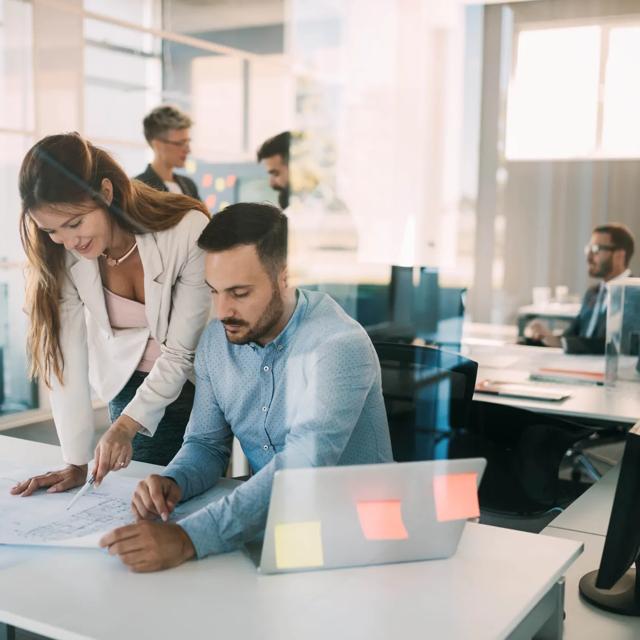 Group of coworkers working together on business project in office